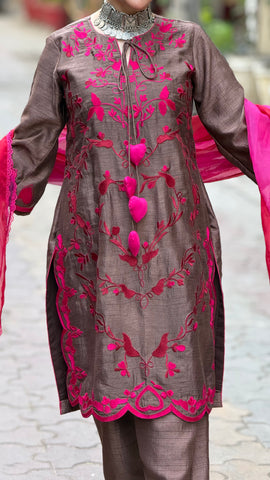 Machine embroidered suit