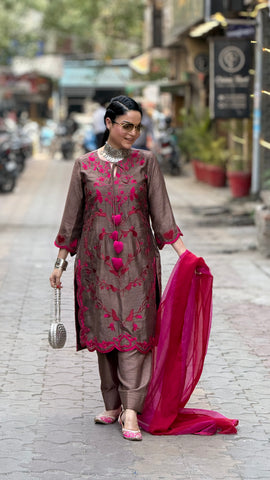 Machine embroidered suit